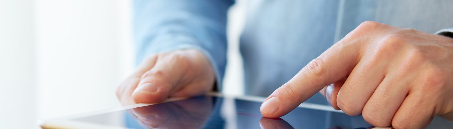 Man touching digital tablet